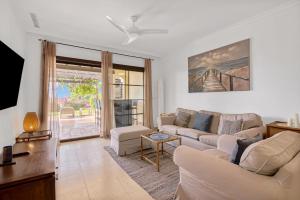 a living room with a couch and a table at Villa Gadea 4-2 in Altea