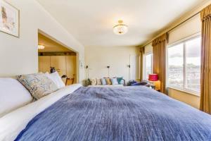 a large bed in a room with a large window at Two Bedroom, Two Newly Renovated Bathrooms, Deck in San Francisco