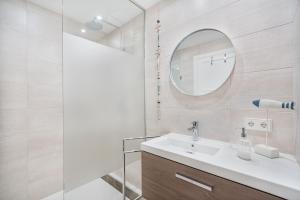 a bathroom with a sink and a mirror at Cana Ferrera in Port de Pollensa +13 photos