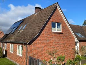 a house with solar panels on the roof at Ferienwohnung, Schwerin in Schwerin +6 photos