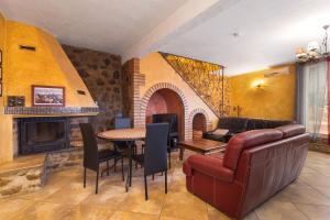 a living room with a couch and a table at Tour Catalane in Ille-sur-Têt