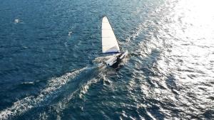 an overhead view of a small sail boat in the water at Nikiana Sailing Beach Club in Nikiana
