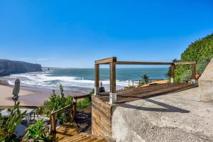 a view of a beach with the ocean at Abrigo do Pescador in Aljezur