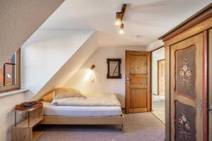 a bedroom with a bed and a staircase at Feriendomizil Berta Benzingen 2 in Winterlingen