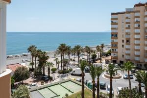 a view of the beach from the balcony of a building at Estudio Bloque 80 in Torrox