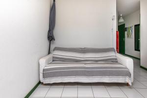a bed in a room with a wall at Appartement Fred in Moliets-et-Maa +13 photos