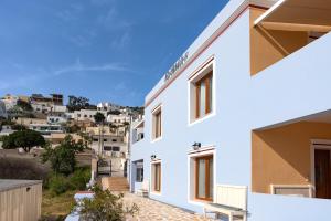 a white house with a view of the city at Anemi Leros Apartments 1 in Panteli