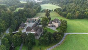 an aerial view of a large house in a field at Gut Wenne in Eslohe
