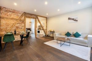 a living room with a couch and a table at Altstadt-Oase 2 in Cottbus