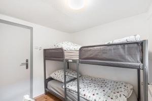 a bedroom with two bunk beds in a room at Das Häuschen 1650 in Alsfeld