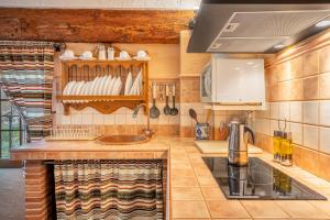 a kitchen with a sink and a stove at Romero in Hinojares