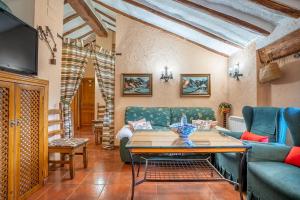 a living room with a couch and a table at Romero in Hinojares