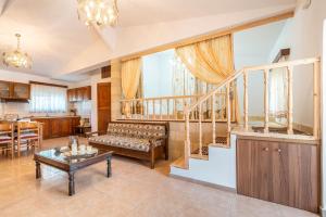 a living room with a couch and a table at Absinthia Fanes in Rhodes Town