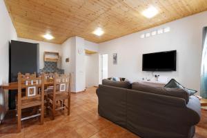a living room with a couch and a table at Casa Verol B in Moya