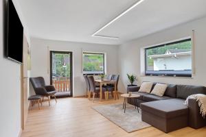 a living room with a couch and a table at Gästehaus Schwörer in Lenzkirch