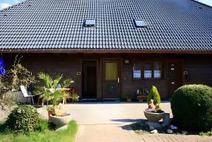 a house with a tile roof at Ferien Auf Dem Steingrubenhof in Sankt Peter