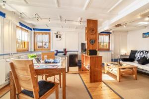 a living room with a table and a couch at Schuler-Haus in Balingen