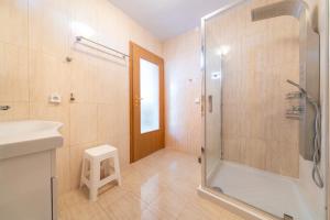 a bathroom with a shower and a sink at Melissa apartments in Halikounas