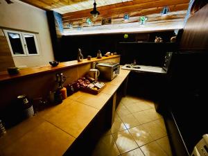 a kitchen with a counter and a sink at DiMarS in Megara +33 photos