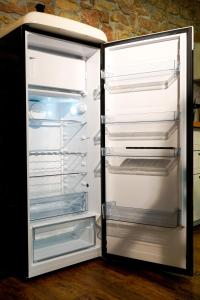 an empty refrigerator with its door open with itsartments at Fewo Heimat - Bad Dürkheim in Bad Dürkheim