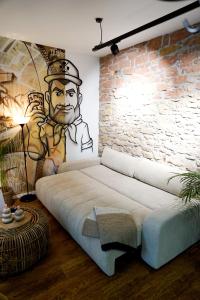 a room with a bed with a mural on the wall at Fewo Heimat - Bad Dürkheim in Bad Dürkheim