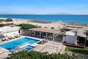 an overhead view of a pool and a beach at Iguana studio 5 in Preveza