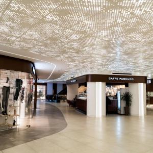 a shopping mall with a ceiling covered in lights at Mercury Suites Premium Apartments With Pool Access in St. Julianʼs +152 photos