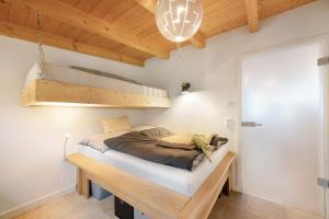 a bedroom with a bed in a room with a loft at Ferienhaus mit Panoramablick in Gernrode