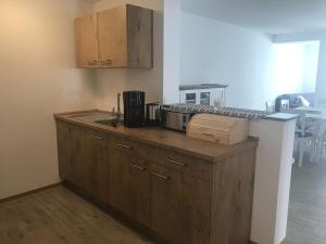 a kitchen with a counter with a microwave on it at Ferienwohnung, 110qm in Hohen Wangelin