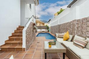 a patio with a pool in a house at Casa Ohana Fuengirola in Fuengirola
