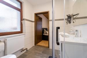 a bathroom with a sink and a mirror at Evin's Apartment in Kehl am Rhein +26 photos