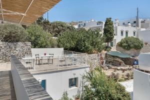 a view from the balcony of a white building at Politimis Studio N1 in Amorgos +21 photos