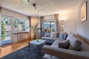a living room with a couch and a table at Haus Gisela - Stockkamp in Todtmoos