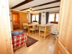 a living room with a table and a dining room at Erlenhof in Todtnau