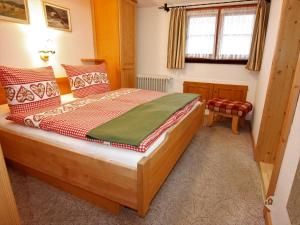 a bedroom with a large wooden bed in a room at Erlenhof in Todtnau