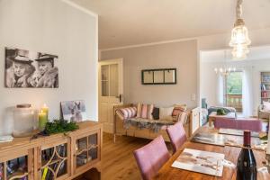 a living room with a table and a couch at Lina in Rottenbuch