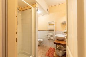 a bathroom with a toilet and a sink at La Terrazza, Cetona, Toscana in Cetona