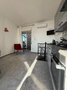 a kitchen with a stove top oven in a room at Casa Mark in Forza dʼAgro +15 photos