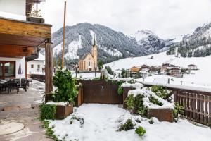 a town in the mountains covered in snow at Hotel Sonnblick - Wohnung Klaus in Kartitsch