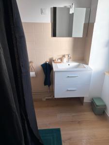 a bathroom with a white sink and a mirror at L auberge des marais proche Marennes Oléron in Saint-Just +30 photos