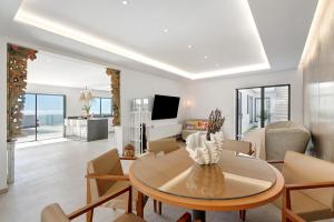 a living room with a table and chairs at Alba House in Adeje