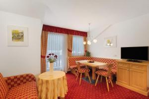 a living room with a couch and a table at Loderhof Sand in Taufers in Sand in Taufers