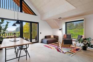 a living room with a table and a couch at Ferienappartements Bayer in Sigmarszell
