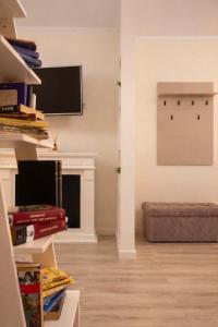 a living room with a couch and a fireplace at DG - Urban Stay in Floreşti