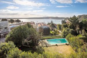 a swimming pool with a view of the water at São Martinho All The Best in São Martinho do Porto