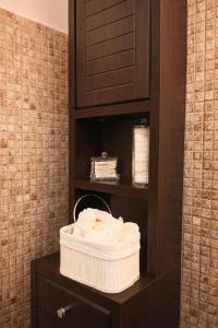 a bathroom with two towels in a cabinet at DG - Urban Stay in Floreşti