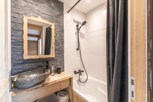a bathroom with a sink and a shower at Le Chappart - Carroz d'Arâches in Arâches-la-Frasse +12 photos
