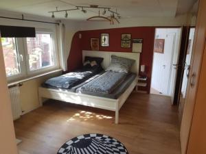 a bedroom with two beds in a room at Haus Mara in Emden