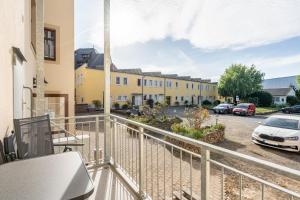 a balcony with a view of a parking lot at Ferienwohnung im Hotel Reichskrone in Heidenau