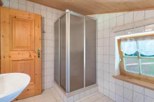 a bathroom with a shower and a sink at Ferienwohnung Spielberg in Sankt Martin bei Lofer +14 photos